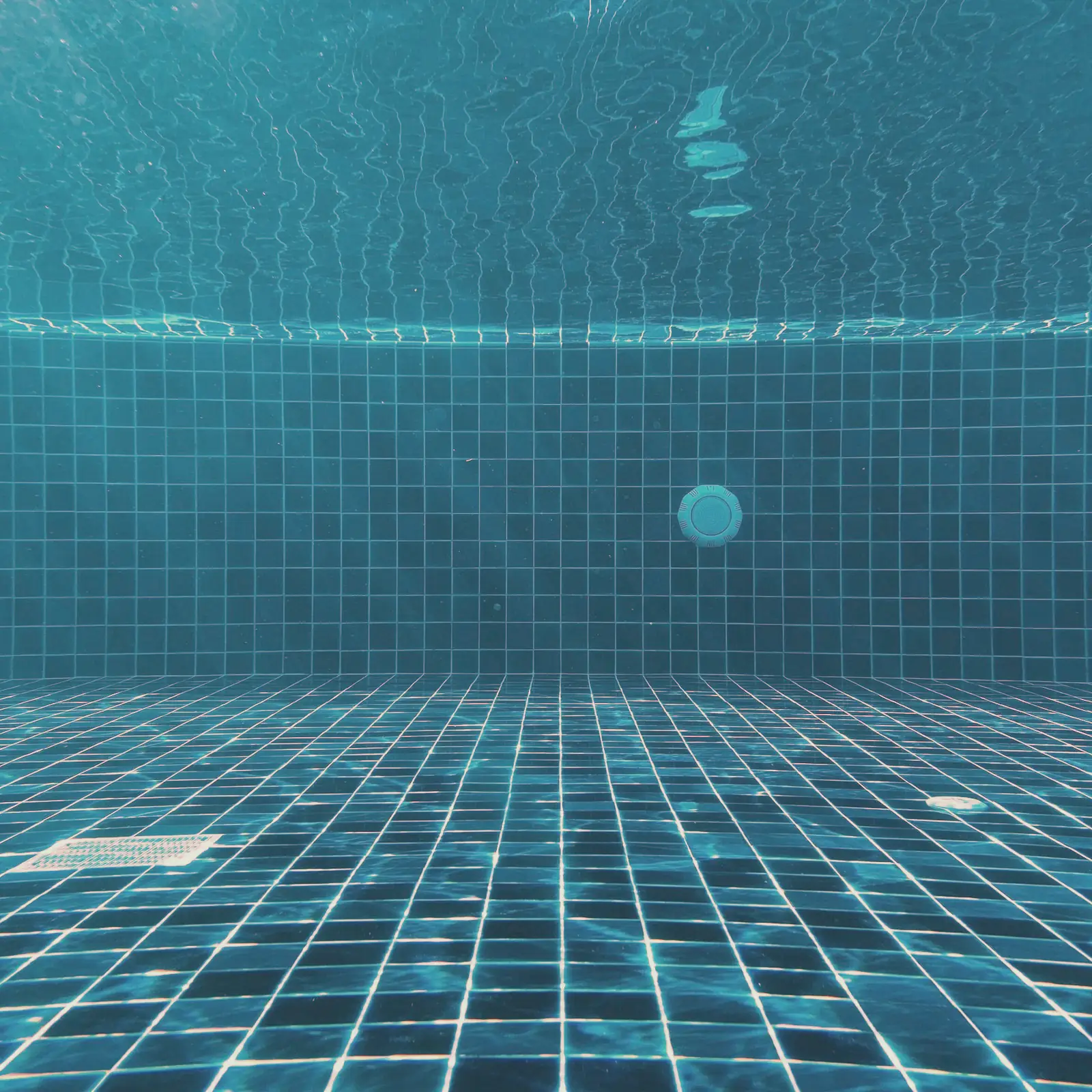Blue tile on the floor of a clean pool
